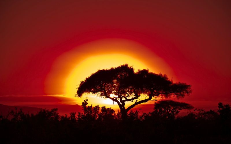 O sol se pondo em Gana, na África